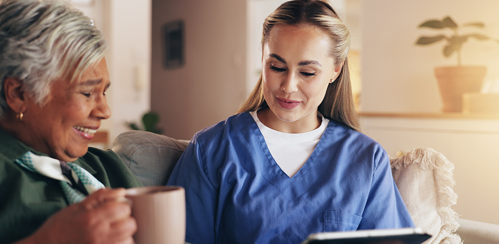 nurse tablet senior woman sofa home with results news listen conversation with medical report people caregiver digital touchscreen with coffee consulting app retirement